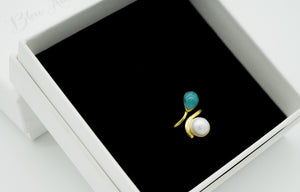 Ba delicate pearl and larimar stone gold-plated sterling silver ring. Reach for a delicate and exquisite ring that plays with larimar stone and a beautiful pearl.